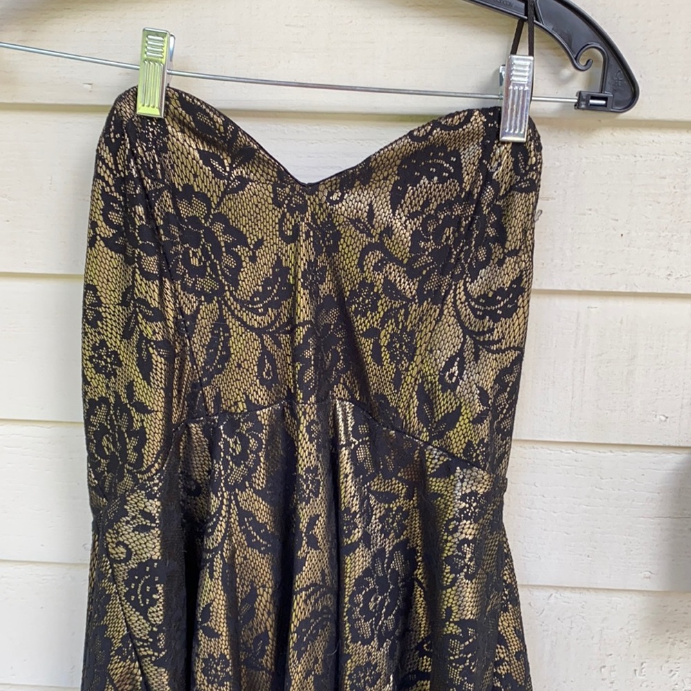 Juniors strapless mini dress in gold and black